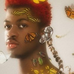 Lil Nas X posing with butterflies