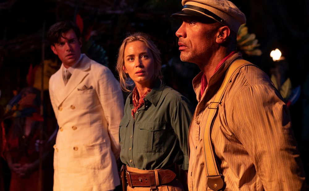 A scene from Jungle Cruise where Emily Blunt looking at Dwayne Johnson with concern
