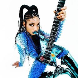 Willow Smith posing with guitar