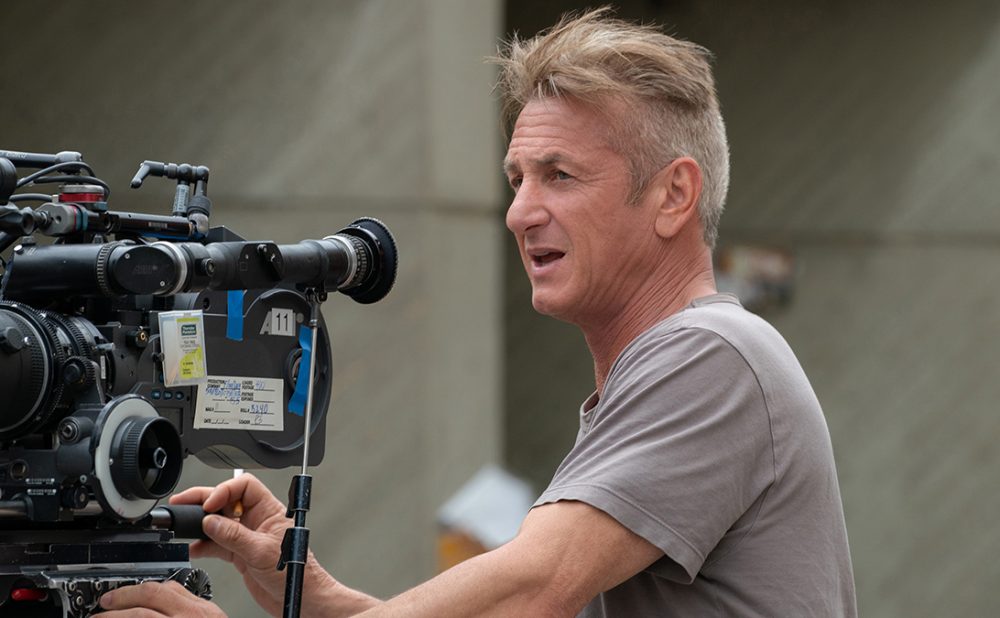 Sean Penn behind a film camera, directing on the set of Flag Day.