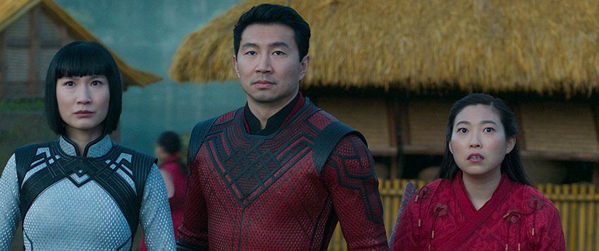 Meng'er Zhang, Simu Liu and Awkwafina standing side-by-side in the film Shang-Chi.