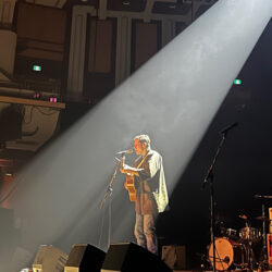 Afie Jurvanen performing on stage in Calgary.