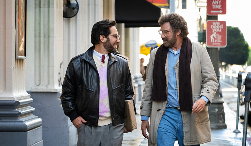 Paul Rudd and Will Ferrell looking at each other as they walk down the street, from the show The Shrink Next Door.