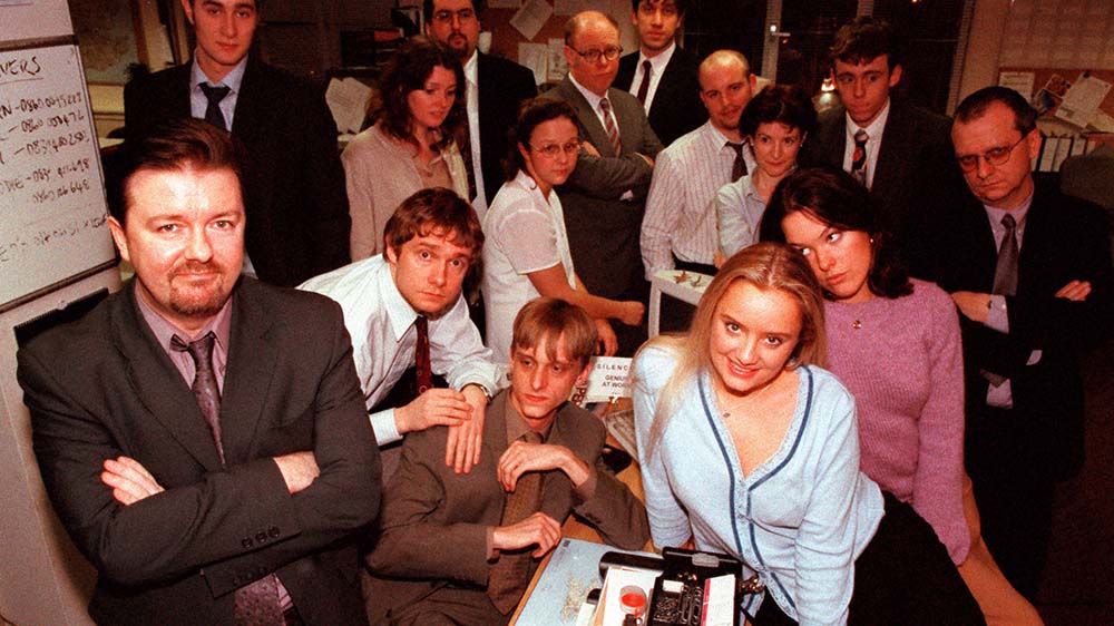 Cast of the British Office posing as characters from the show