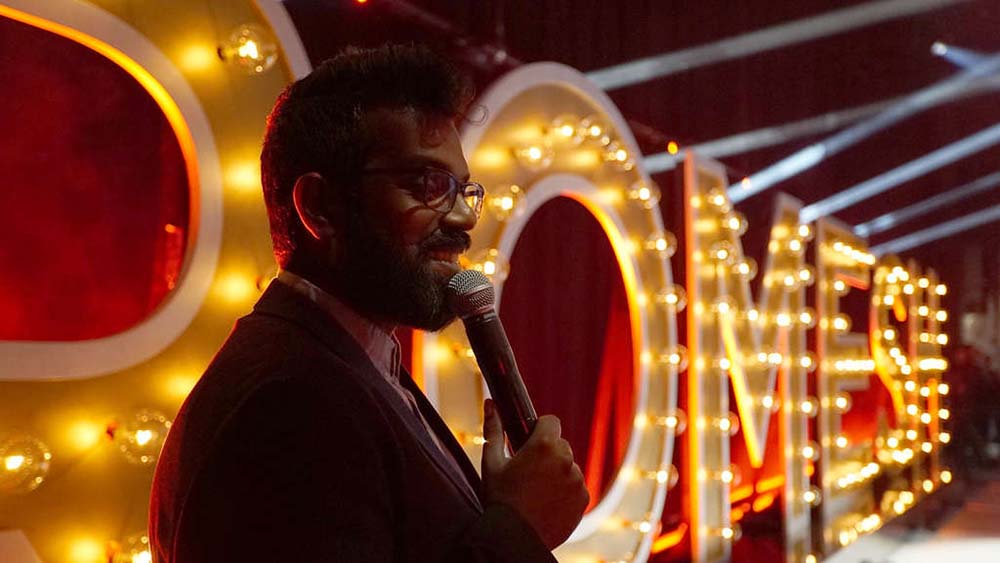 Screenshot from Just Another Immigrant: Romesh at the Greek
