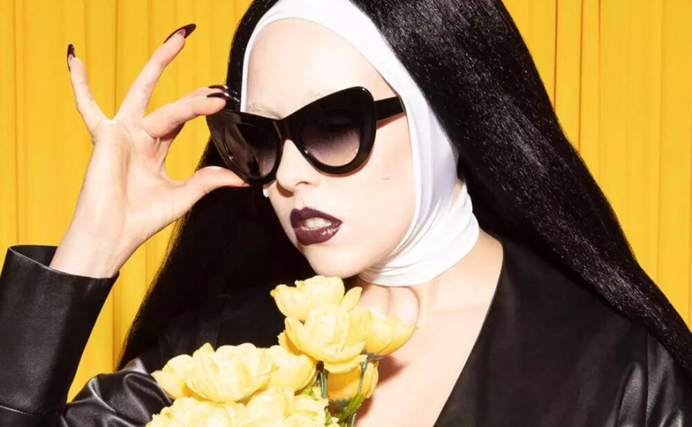 Allie X posing in nun outfit