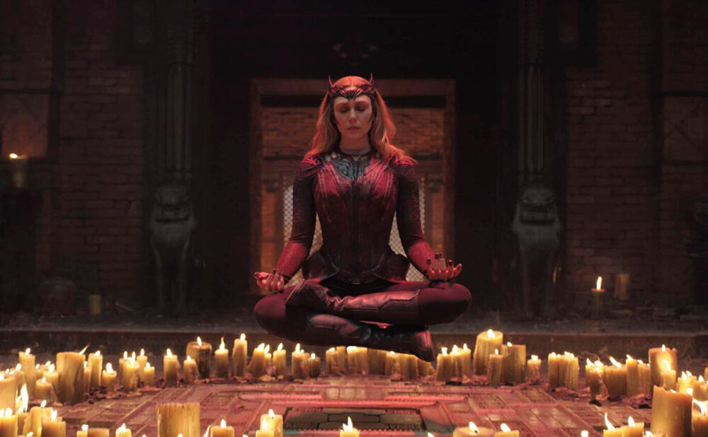 The Scarlet Witch floating above circle of candles