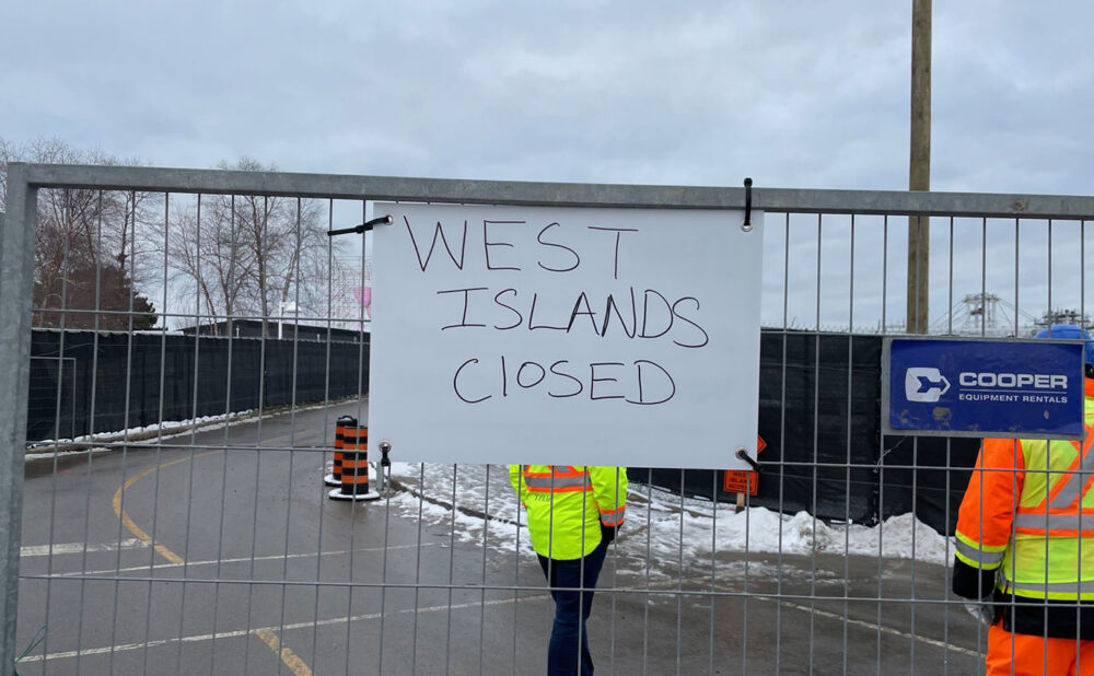 The haphazardly placed sign announcing the closure of Ontario Place's West Island (which can't even get the number of islands right).