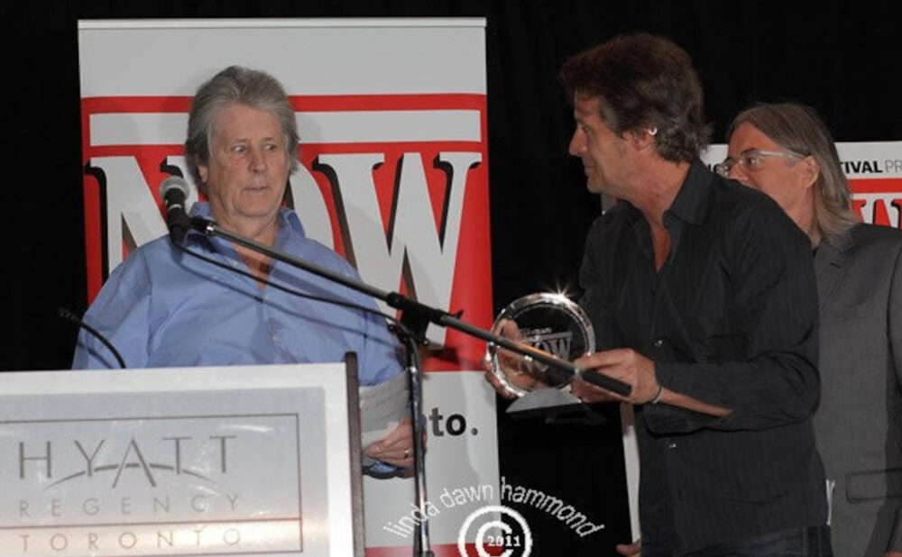 Brian Wilson receives NOW Magazine Special achievement Award from Jim Cuddy and Michael Hollett at NXNE 2011